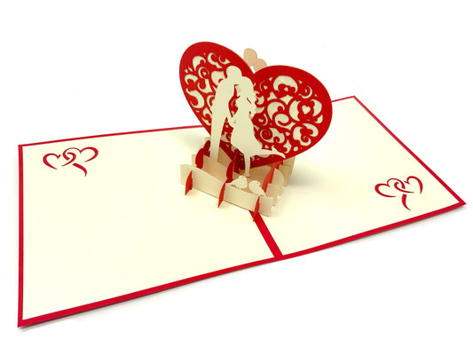 &quot;Lovers in heart pop-up card: A three-dimensional card featuring a beautifully designed and intricately crafted pop-up scene of two lovers forming a heart, symbolizing affection and romance.&quot;