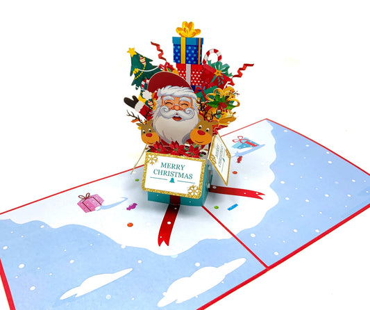 &quot;Santa in a Box pop-up card: A three-dimensional card with an intricately crafted pop-up scene featuring Santa Claus in a festive box, perfect for adding holiday cheer to various occasions.&quot;