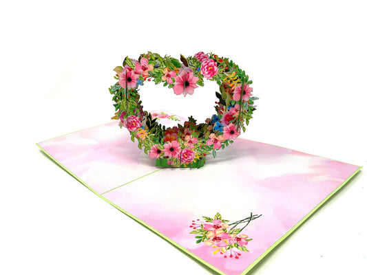 &quot;Floral heart pop-up card: A three-dimensional card featuring an intricately designed heart-shaped pop-up adorned with vibrant and detailed floral decorations, evoking a sense of beauty and romance.&quot;