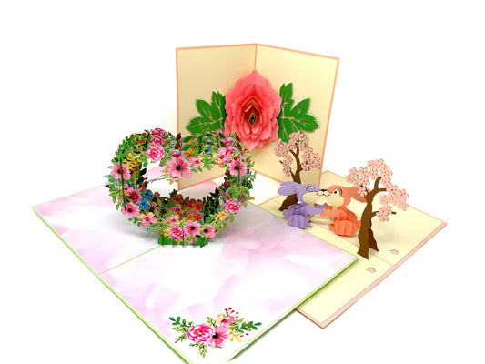 &quot;Pretty Pinks 3-pack pop-up cards: A collection of three three-dimensional cards with intricately crafted pop-up scenes featuring beautiful pink elements, perfect for various occasions and charming designs.&quot;