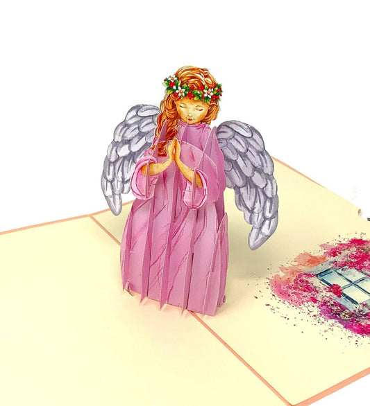 3D pop-up greeting card: A praying angel with delicate features, dressed in a pink gown, exuding a sense of serenity and grace.&quot;