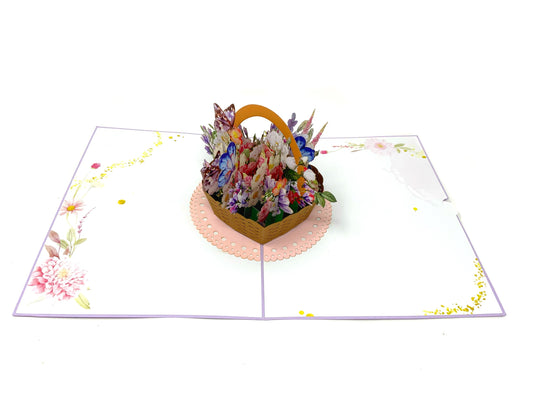 &quot;A flower basket pop-up card: A 3D paper card featuring an intricately designed and colorful pop-up of a flower basket, showcasing vibrant floral details and artistic craftsmanship.&quot;